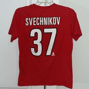 NHL Carolina Hurricanes #37 Andrei Svechnikov Red Eye Logo Jersey shirt L 14/16